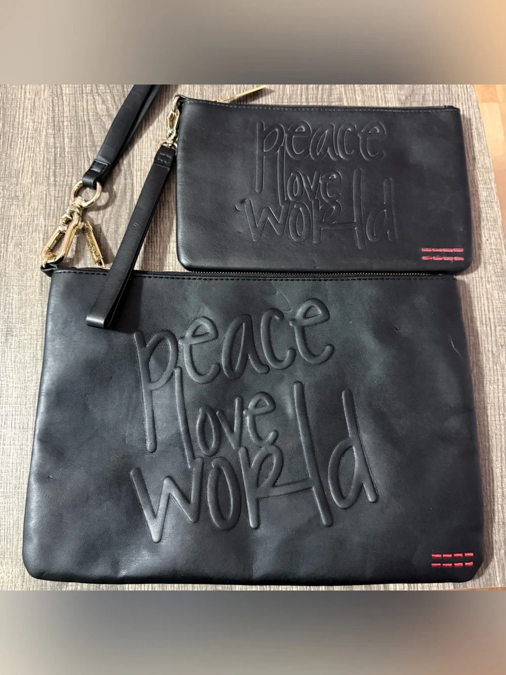 2 Peace Love World Black Embossed Leather Clutch Wristlets
